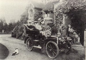 "Mr and Mrs Marshall and family in their car in Pinner 1904"